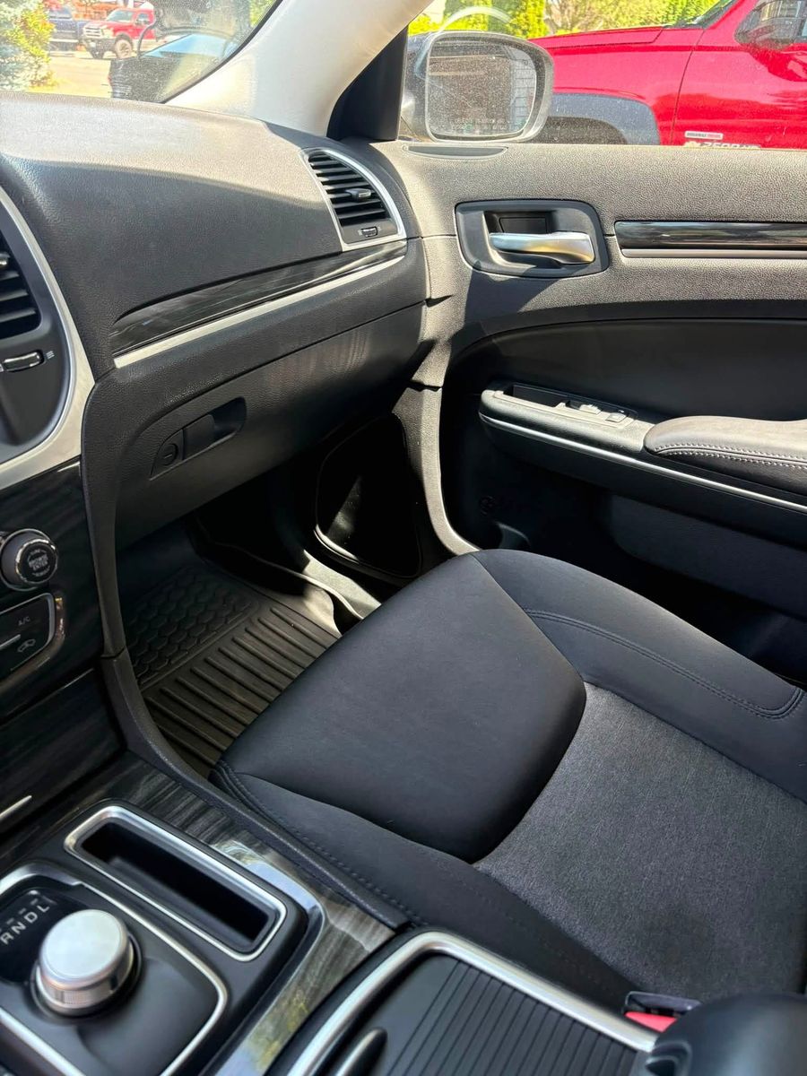 Cleaned passenger door panel and dashboard of a Chrysler 300